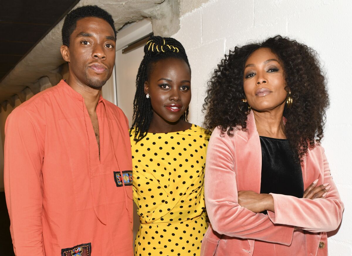 Chadwick Boseman, Lupita Nyong'o and Angela Bassett at a "Black Panther" event