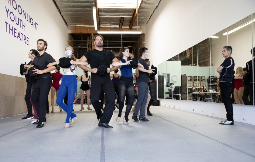 Hector Guerrero, the director and choreographer of the musical "A Chorus Line", right, rehearses with the cast.