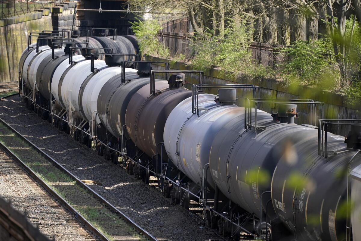 FILE - A Norfolk Southern freight train rolls through the Northside of Pittsburgh on April 9, 2021. Norfolk Southern’s third-quarter profit jumped 32% even though the number of shipments the railroad delivered remained relatively flat because it was able to increase prices on most categories of freight. (AP Photo/Gene J. Puskar, file)