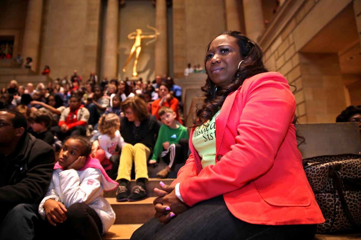 Dance director Tawanda Jones, who founded the team, watches the troupe perform.