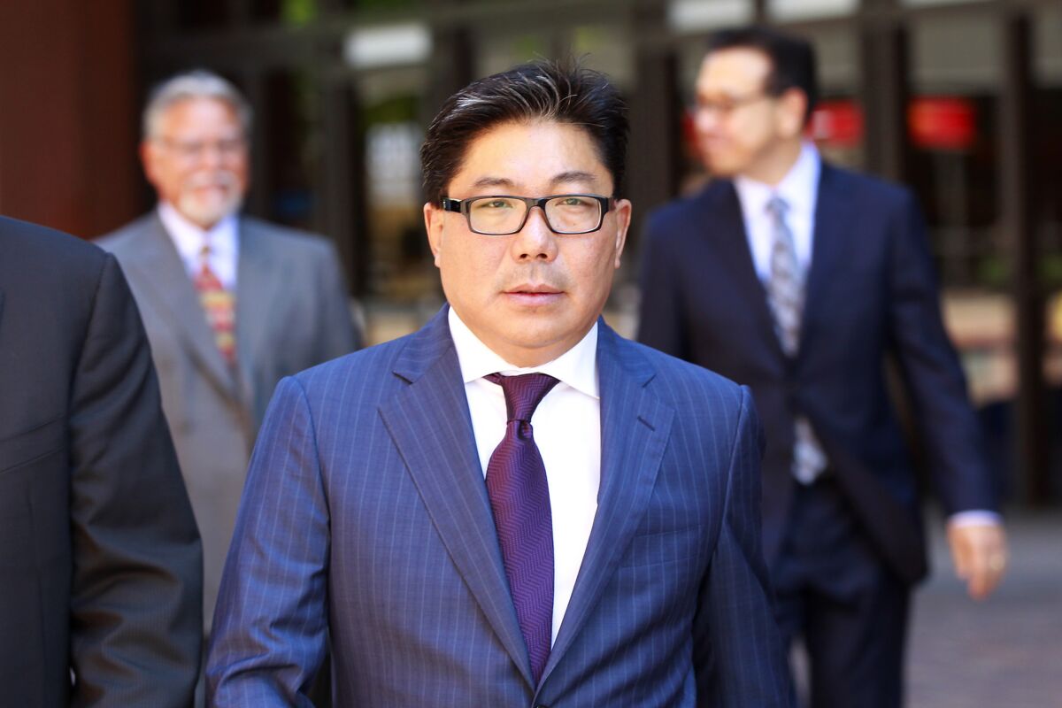 José Susumo Azano Matsura leaves federal court in San Diego on Aug. 21, 2014.
