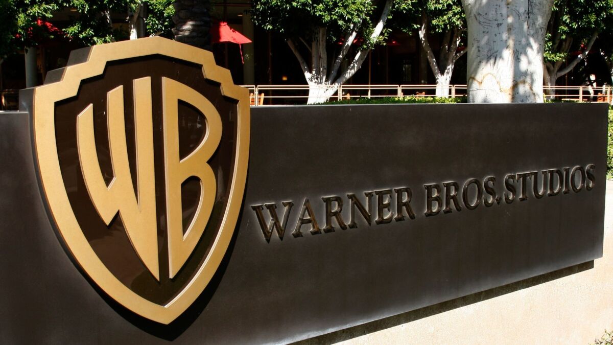 The Warner Bros. logo is prominent outside the studio lot in Burbank. (Amy T. Zielinski / Getty Images)