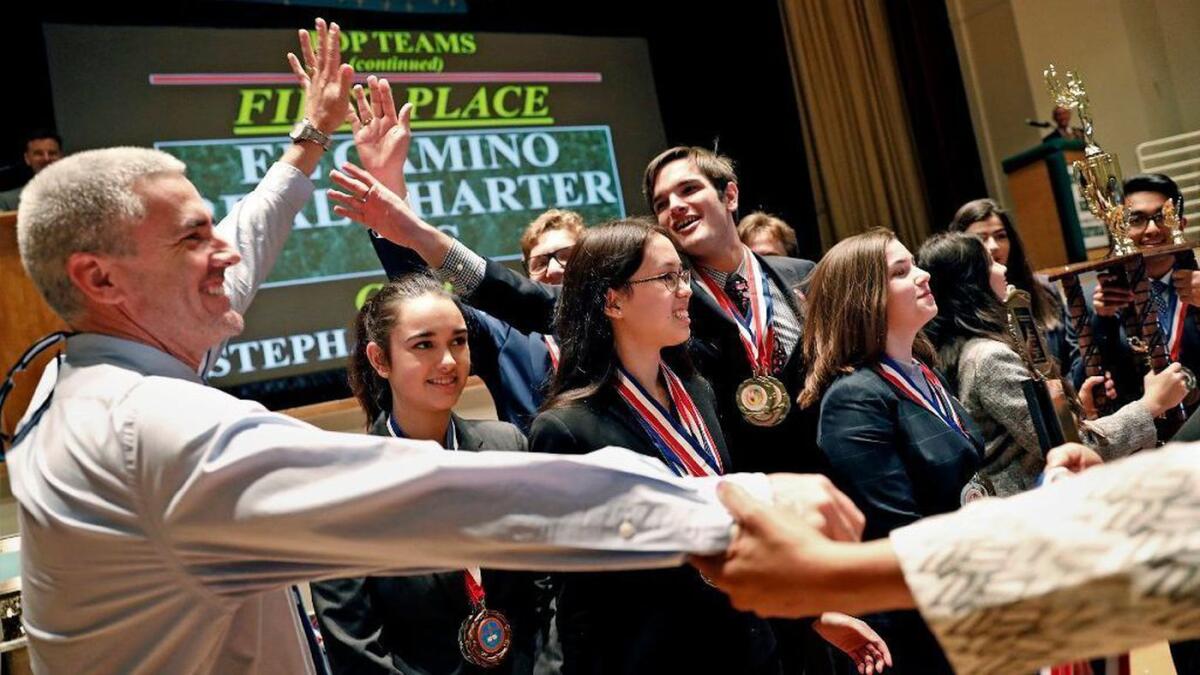 El Camino Real Charter High School students celebrate decathlon win.