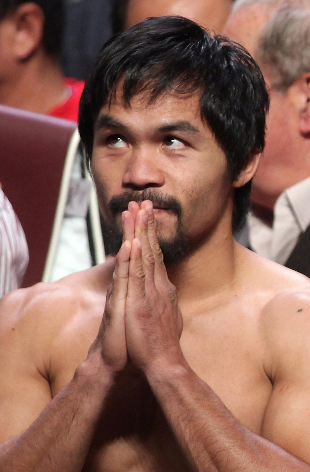 Manny Pacquiao of the Philippines posing during his weigh-in with Juan Manuel Marquez of Mexico.
