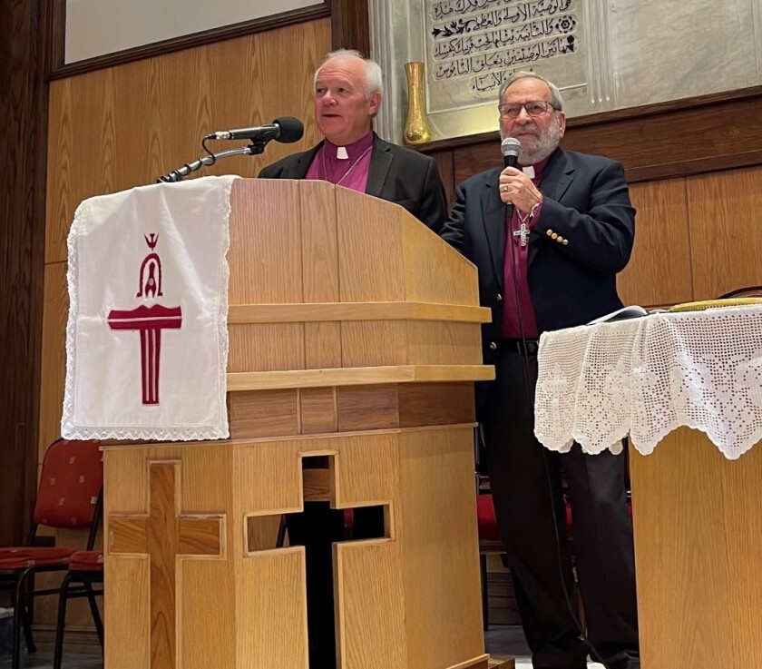The Rev. Jack Baca preaching at a Presbyterian church in Damascus in October;  interpreter on the right.