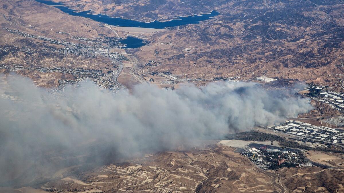 Smoke from the Rye fire obscures Interstate 5 near Magic Mountain (lower right) in Santa Clarita.
