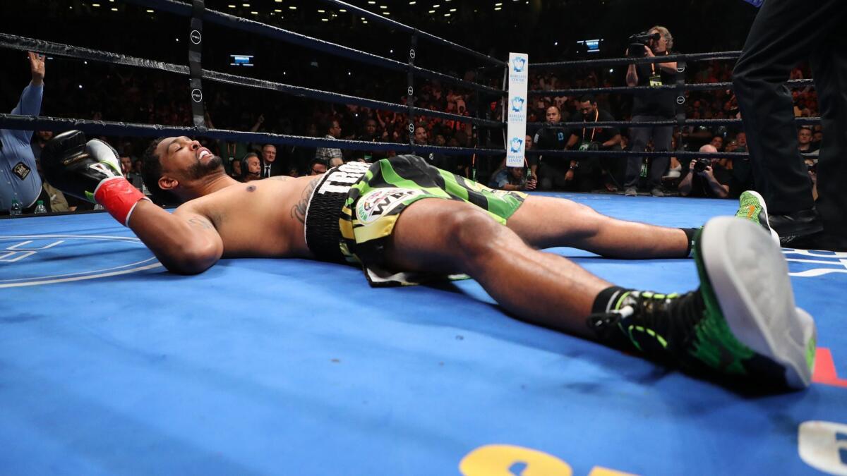 Dominic Breazeale tries to get up after being knocked down by Deontay Wilder during their heavyweight title fight in New York on May 18. Wilder was declared the winner by knockout seconds later.