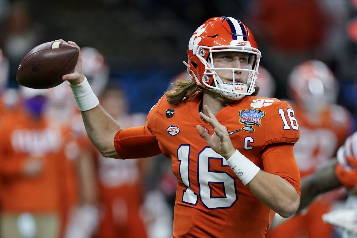 Clemson quarterback Trevor Lawrence passes during a game.