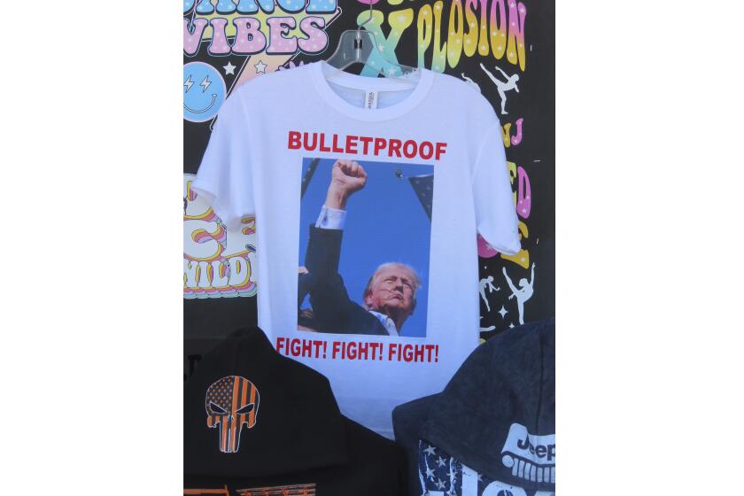 T-shirts referencing the shooting of former President Donald Trump were selling briskly on the boardwalk in Wildwood, N.J. on July 15, 2024, less than 48 hours after the incident. (AP Photo/Wayne Parry)