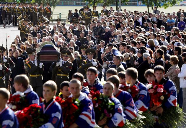 Relatives and friends of Salei follow the casket during his funeral in Minsk.