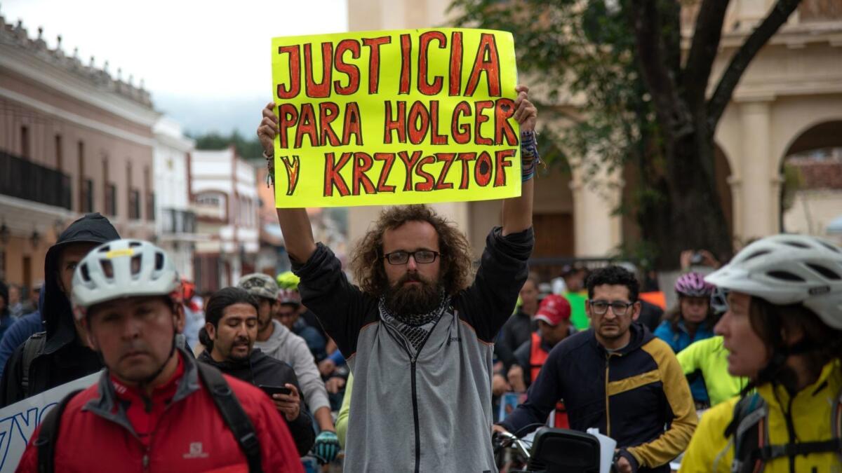 Friends of Holger Franz Hagenbusch and Krzysztof Chmielewski-Podroznik, cyclists who disappeared in the Mexican state of Chiapas, protest May 6 in San Cristobal de las Casas.