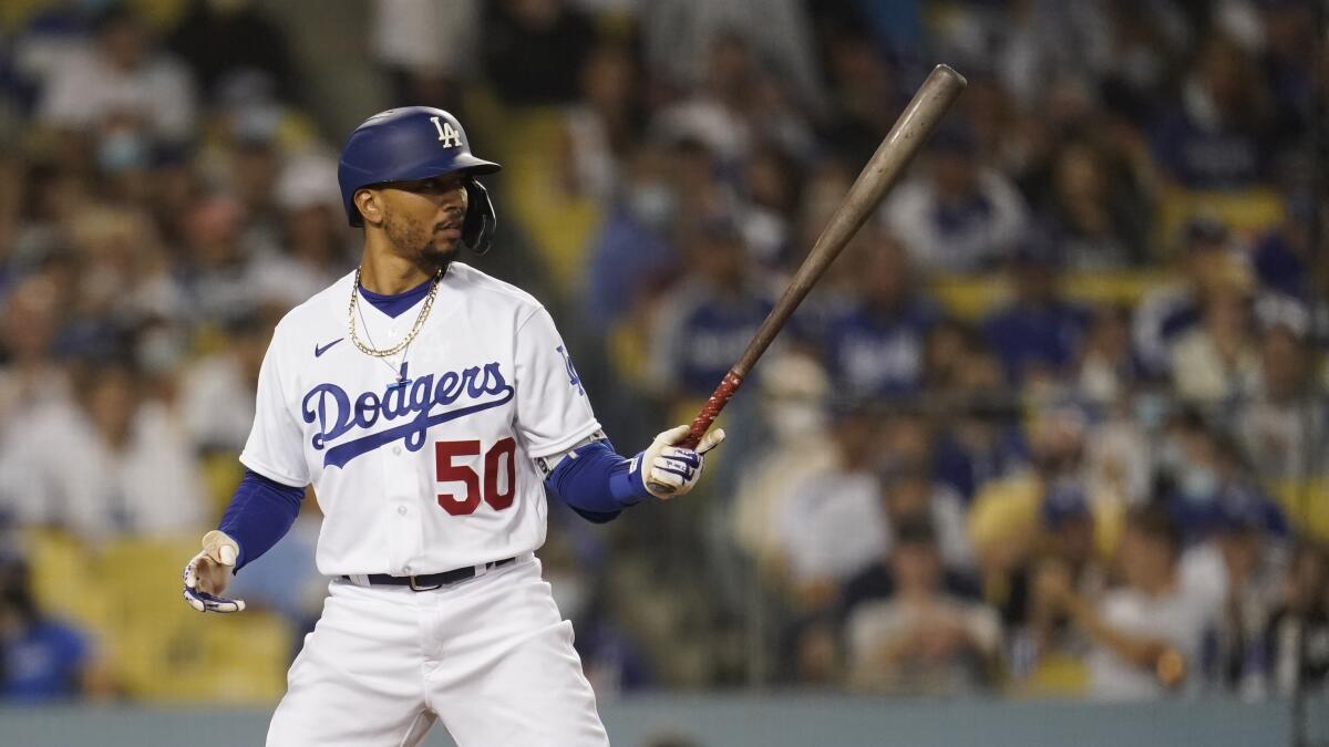 Los Angeles Dodgers' Mookie Betts bats during a baseball game against the Atlanta Braves.