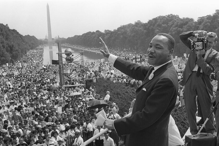 (FILES) In this file photo taken on August 28, 1963 The civil rights leader Martin Luther King (C) waves to supporters during the "March on Washington" on the Mall in Washington, DC. Towards the end of his life, Martin Luther King Jr. lamented that his dream had "turned into a nightmare." The US civil rights leader was a weary man when he was cut down by an assassin's bullet at the age of 39 on the balcony of a motel in Memphis, Tennessee on April 4, 1968. / AFP PHOTO / --/AFP/Getty Images ** OUTS - ELSENT, FPG, CM - OUTS * NM, PH, VA if sourced by CT, LA or MoD **