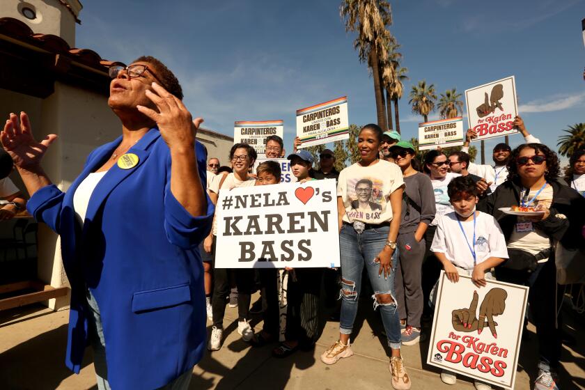 LOS ANGELES, CA - NOVEMBER 4, 2022 - - Los Angeles Mayoral Candidate Rep. Karen Bass campaigns at Echo Park lake on Saturday, November 4, 2022. Bass was on a bus tour campaigning in various parts of Los Angeles before Tuesday's election. First Gentleman Douglas Emhoff, actor Alfre Woodard, actor Robert Montoya of Culture Clash and California Assembly Member Wendy Carrillo were in attendance. (Genaro Molina / Los Angeles Times)