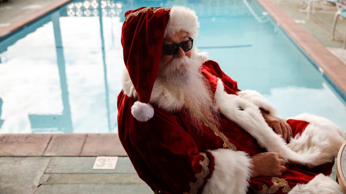 HOLLYWOOD, CA--FEBRUARY 16, 2017-- An actor in Santa clothing gets in his "background" position poolside, at a motel in Hollywood, CA, during filming of FX's season three of "Fargo," Feb. 16, 2017.