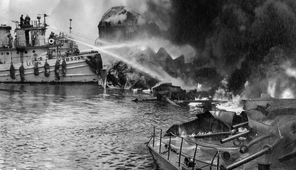 June 22, 1947: Firefighters work to control burning wreckage of the tanker Markay after the ship exploded in L.A. Harbor.