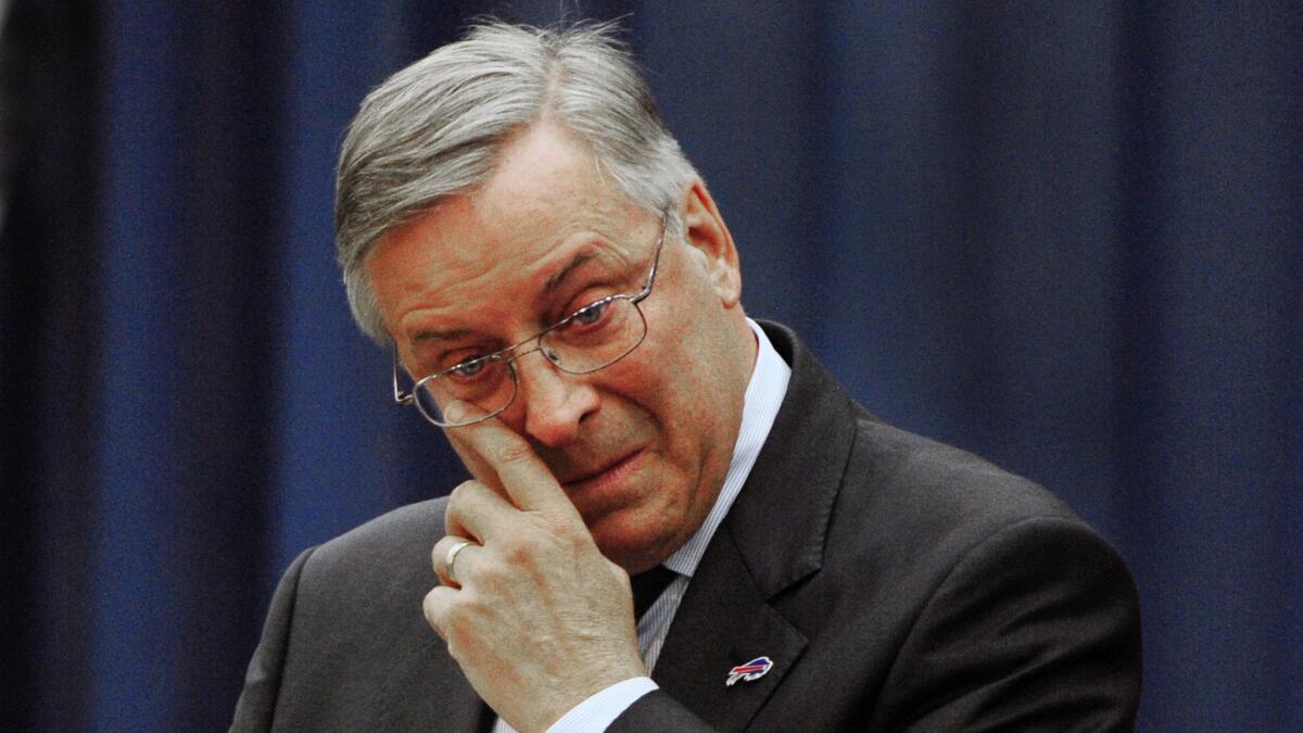 Buffalo Bills owner Terry Pegula is emotional while making his opening remarks during a news conference in Orchard Park, N.Y., on Friday.