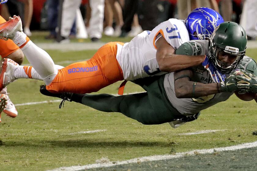 Baylor wide receiver Ishmael Zamora beats Boise State safety Cameron Hartsfield (37) to the goal line to score a touchdown during the second half Tuesday night in Cactus Bowl.