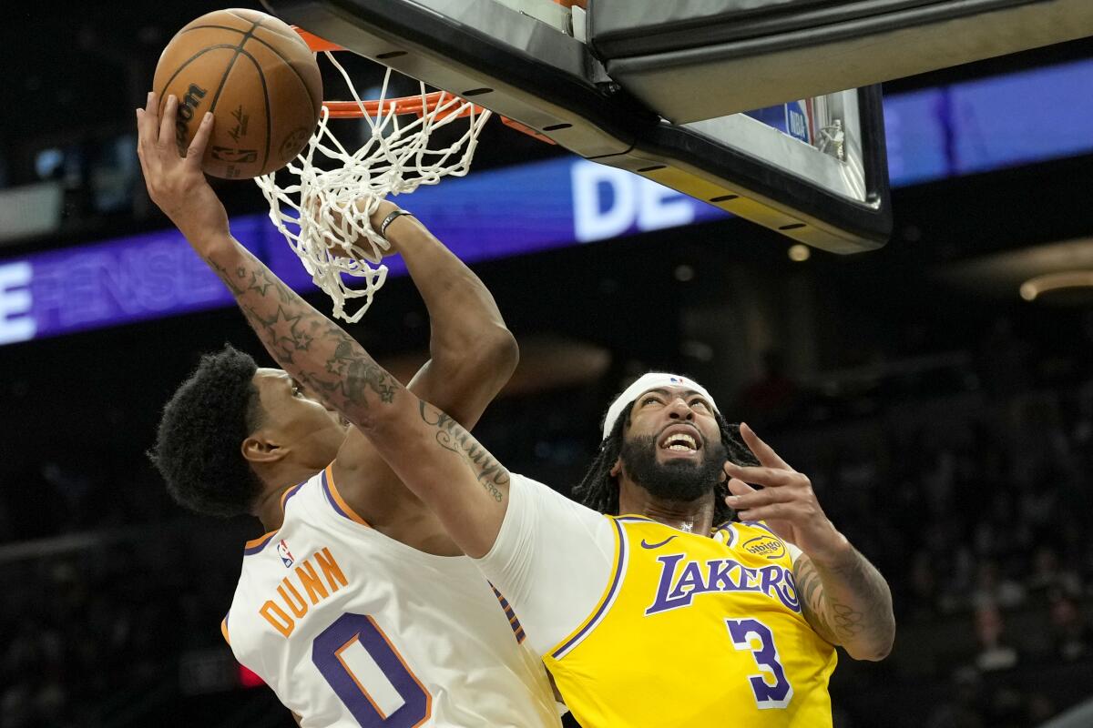 Anthony Davis gets off a shot against Suns forward Ryan Dunn in the first half.