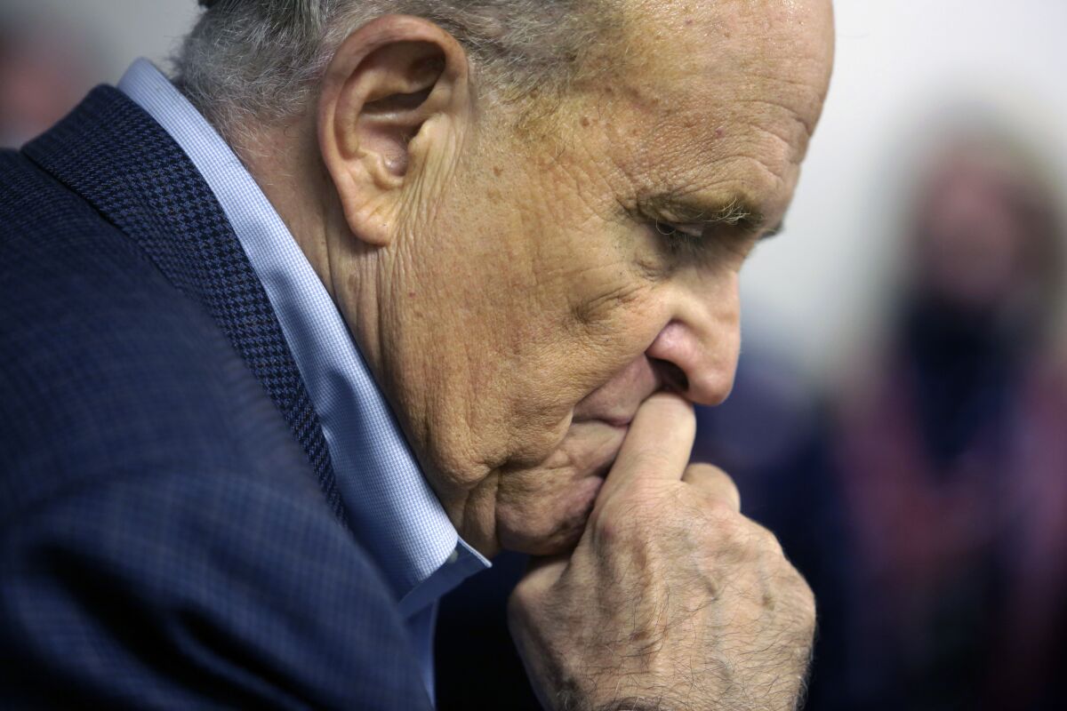FILE - In this Monday, Oct. 12, 2020, file photo, former New York Mayor Rudy Giuliani pauses while addressing supporters of President Donald Trump during a Columbus Day gathering at a Trump campaign field office in Philadelphia. According to court records unsealed Tuesday, May 4, 2021, federal prosecutors have asked a Manhattan federal judge to appoint a “special master” to oversee the review of materials seized the week before from Giuliani's home. (AP Photo/Jacqueline Larma, File)
