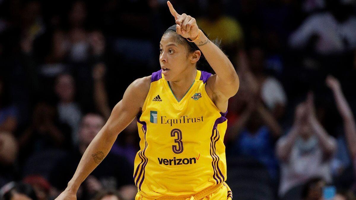 Sparks' Candace Parker celebrates her basket against the New York Liberty during the second half of a game on Aug. 4. The Sparks won 87-74.