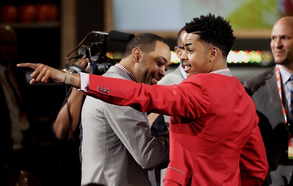 Point guard D'Angelo Russell points to the crowd at Barclays Center after he was selected by the Lakers with the No. 2 overall pick in the 2015 NBA Draft.