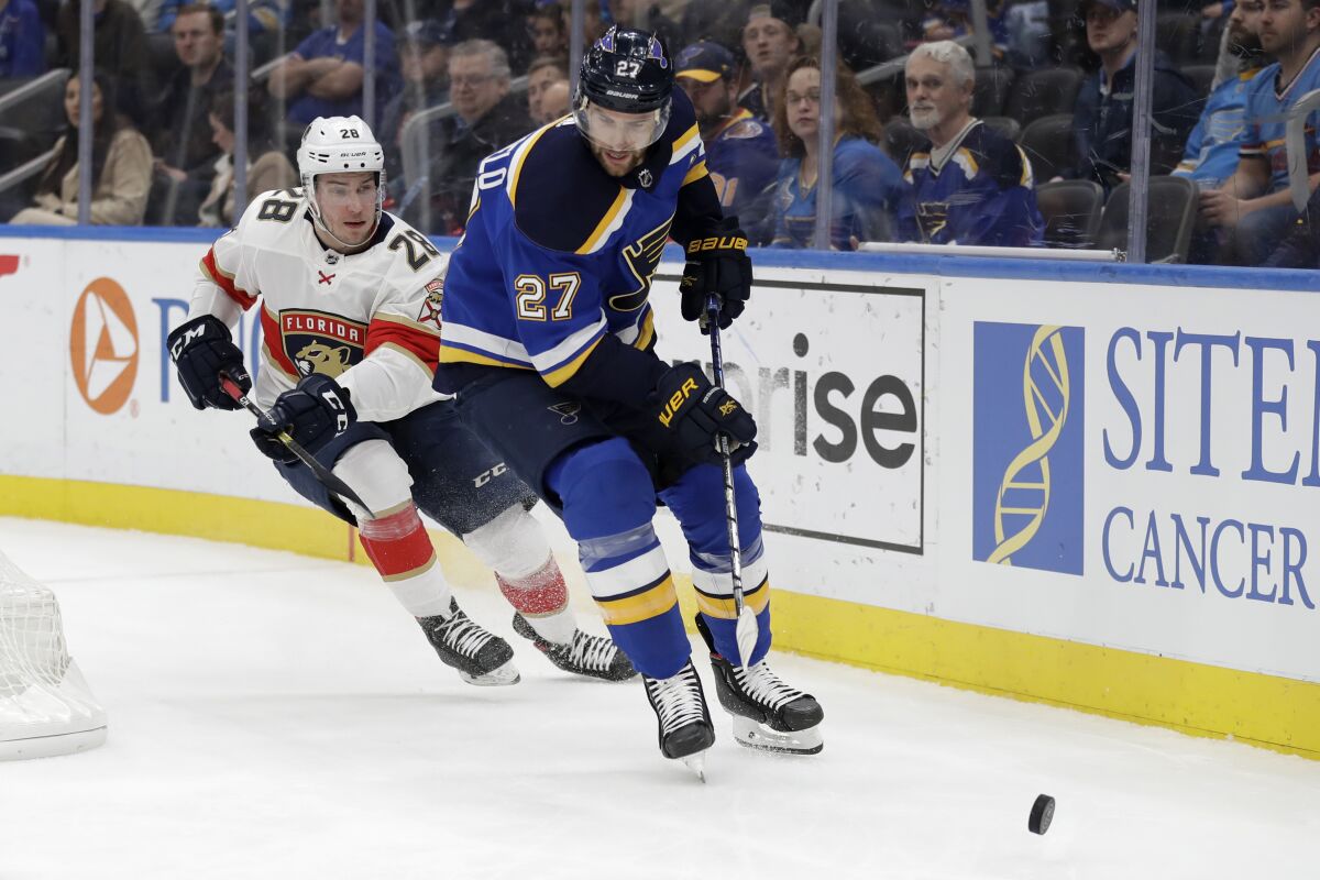 FILE - In this March 9, 2020, file photo, St. Louis Blues' Alex Pietrangelo (27) and Florida Panthers' Aleksi Saarela (28) chase after the puck during the first period of an NHL hockey game in St. Louis. The Vegas Golden Knights have agreed to terms on a $61.6 million, seven-year contract with top free agent Pietrangelo, a person with direct knowledge of the move tells The Associated Press. (AP Photo/Jeff Roberson, File)