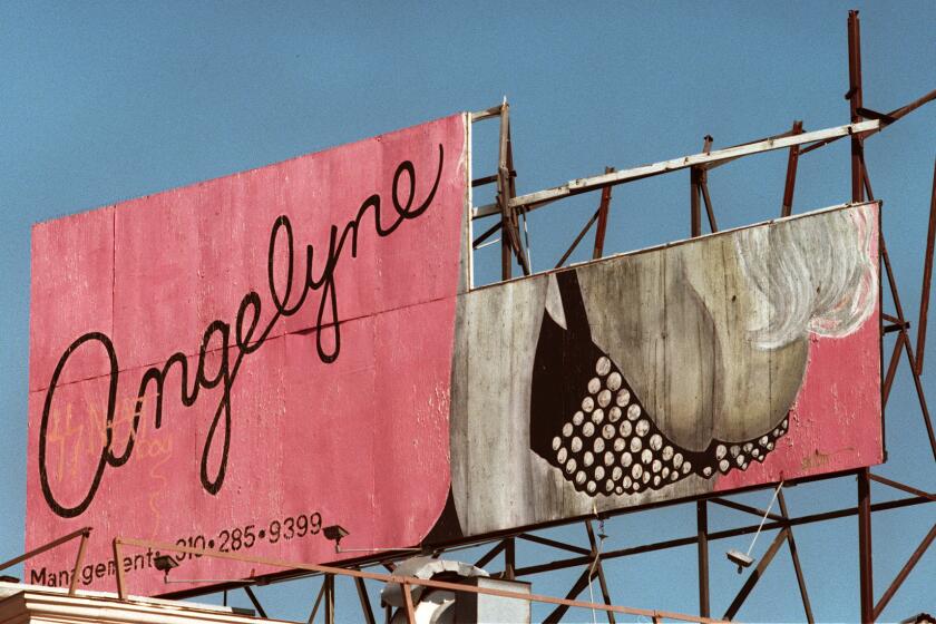 ME.ONLYLA.1.0130.RM.c Angelyne billboard at the intersection of Las Palmas Avenue and Hollywood Blvd., Los Angeles. The head portion of the billboard has fallen down leaving behind Angelyne's breasts to titillate passerbyers. Photographed on 1-30-97. Rick Meyer/LAT THURSDAY FOLDER Mandatory Credit: Rick Meyer/The LA Times
