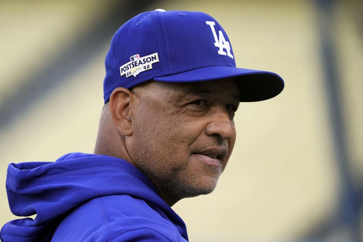 Dodgers manager Dave Roberts watches batting practice during a team workout on Oct. 7.