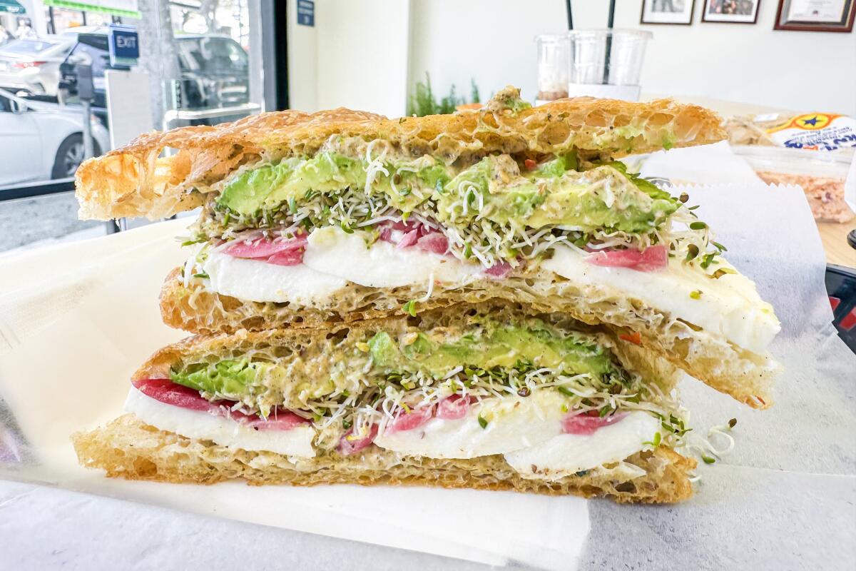 The Mozzarella sandwich features avocado, pickled onion and alfalfa sprouts