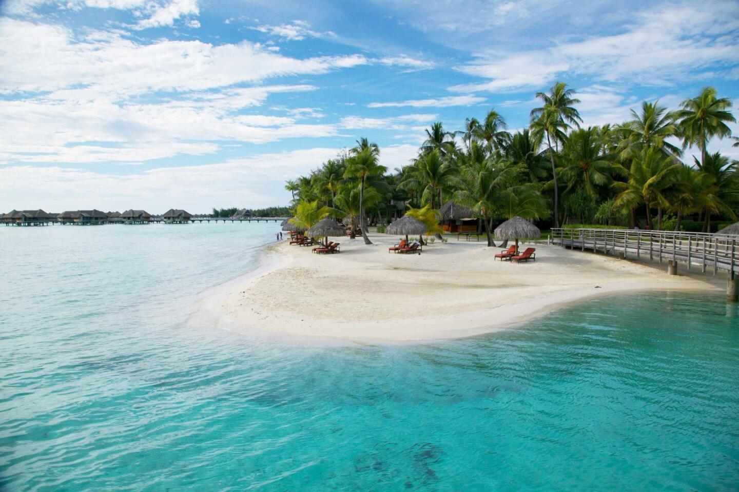 Bora Bora is one of the hottest honeymoon spots. Think scuba diving, clear blue water and private bungalows.