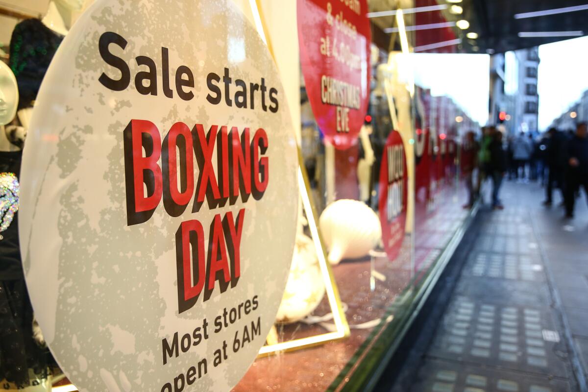 Boxing Day sale signs are posted on Oxford Street in London.
