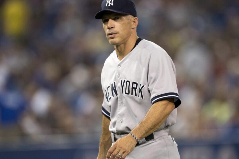 Joe Girardi accepted a four-year contract to remain as manager of the Yankees, the team announced Wednesday.