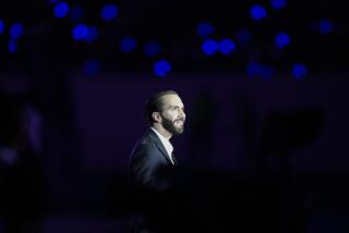 FILE - Salvadoran President Nayib Bukele is illuminated by a stage spotlight during the Central American and Caribbean Games opening ceremony, at the newly remodeled Jorge "El Magico" Gonzalez stadium in San Salvador, El Salvador, June 23, 2023. Bukele was officially nominated by his New Ideas party Sunday, July 9, to run for reelection next year, brushing aside objections from legal experts and opposition figures who say El Salvador’s constitution prohibits his candidacy. (AP Photo/Arnulfo Franco, File)