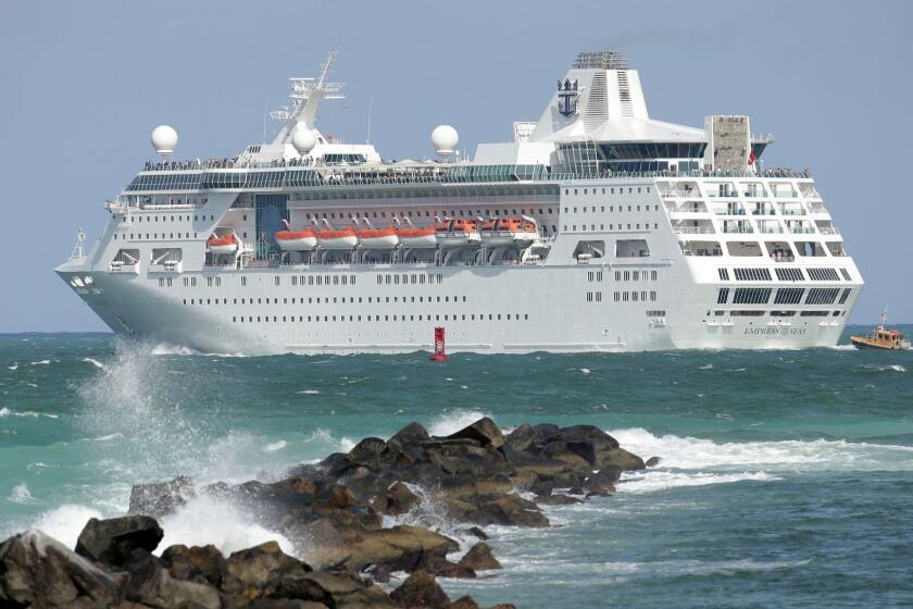 In this Monday, June 20, 2016, photo, the Royal Caribbean cruise ship Empress of the Seas heads out of PortMiami, in Miami Beach, Fla. Royal Caribbean Cruises Ltd. reports earnings, Tuesday, Aug. 1, 2017. (AP Photo/Lynne Sladky)