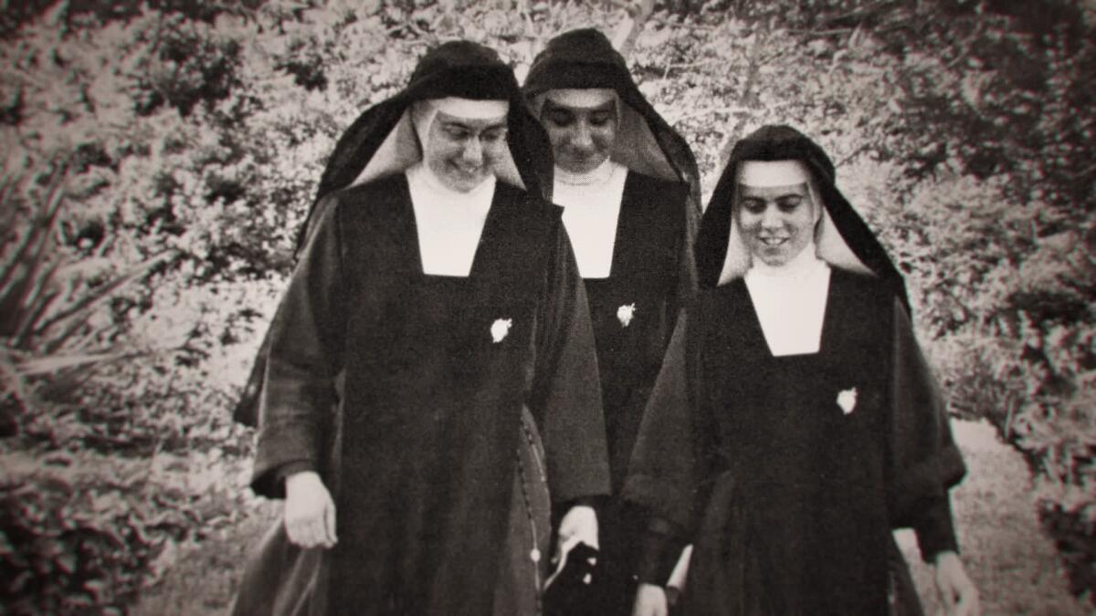 Three nuns in black and white habits