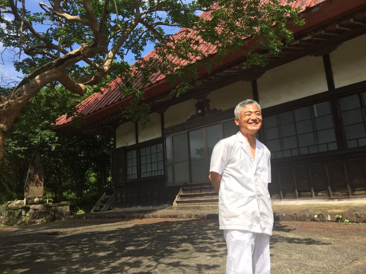 Yoshihiro Shibata visits the temple in Hara-izumi village, Japan. The last monk left years ago because donations were insufficient, given the village's dwindling population.