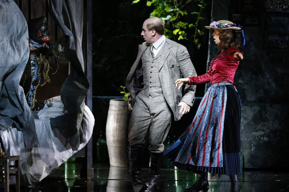 Singers Günther Groissboeck (C) as Der Baron Ochs auf Lerchenau and Sophie Koch as Octavian perform on stage during a dress rehearsal of Richard Strauss' opera 'Der Rosenkavalier' in Salzburg July 29, 2014. The opera will premiere as part of the annual Salzburg Festival (Salzburger Festspiele) on August 1, 2014. The Salzburg Festival, one of the biggest cultural festivals worldwide, will take place from July 27 to August 31, 2014. More than 270 performances in the genres of opera, drama and concert are scheduled at 16 performance venues in Salzburg during the festival. reu