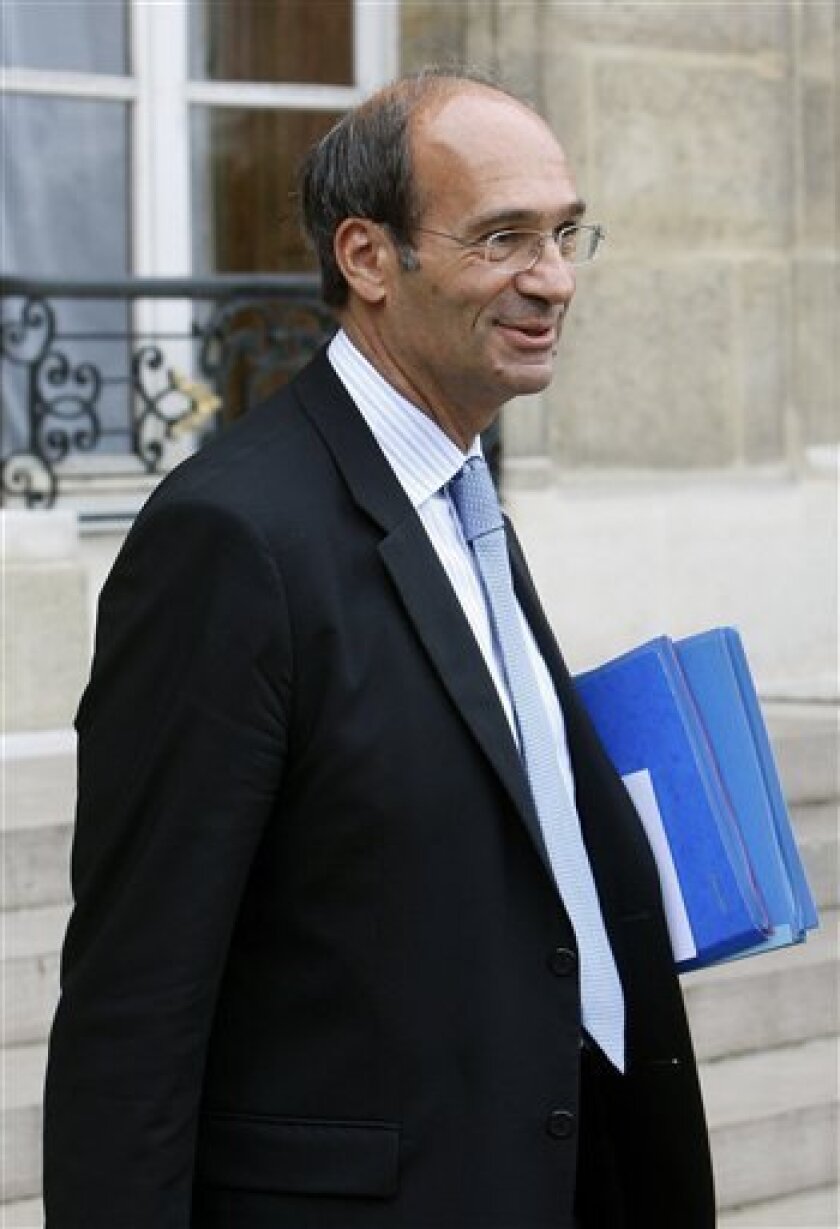 France's Labor Minister Eric Woerth leaves following the weekly cabinet meeting at the Elysee Palace in Paris, Wednesday, Sept. 8, 2010. French President Nicolas Sarkozy has vowed to press ahead with his contested overhaul of the country's pension system, despite a strike and massive protests that saw more than a million people take to the streets.(AP Photo/Michel Euler)