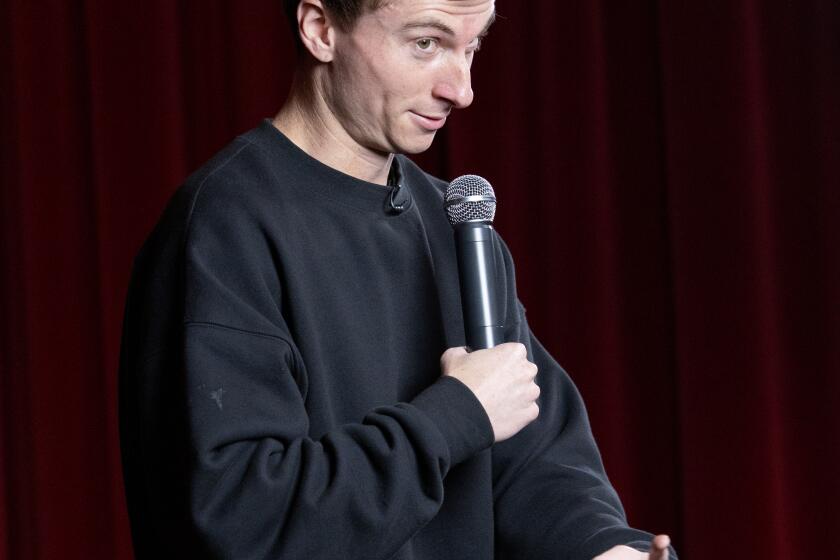 LOS ANGELES, CA - DECEMBER 16, 2023: Comedian Trevor Wallace performs during the LA Times comedy show at the Ace Hotel on December 16, 2023 in Los Angeles, California.(Gina Ferazzi / Los Angeles Times)