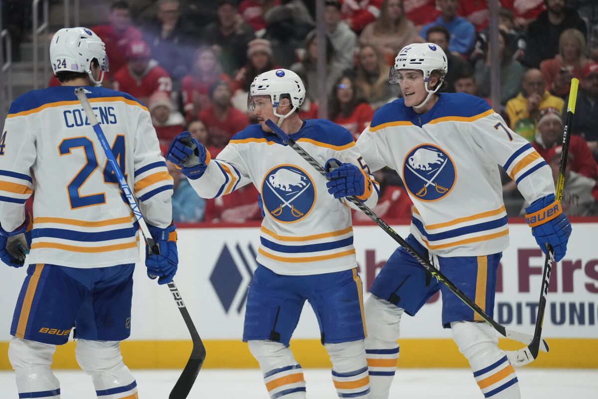 Buffalo Sabres left wing Jeff Skinner, center, celebrates his goal against the Detroit Red Wings in the second period of an NHL hockey game Wednesday, Nov. 30, 2022, in Detroit. (AP Photo/Paul Sancya)