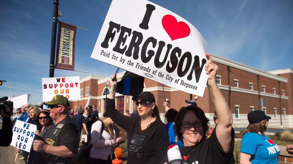 Police supporters rally in Ferguson, Mo., in 2015 after two police officers were wounded by gunfire in the unrest following the fatal shooting of Michael Brown. Jeffrey Williams was convicted of the shootings Friday.