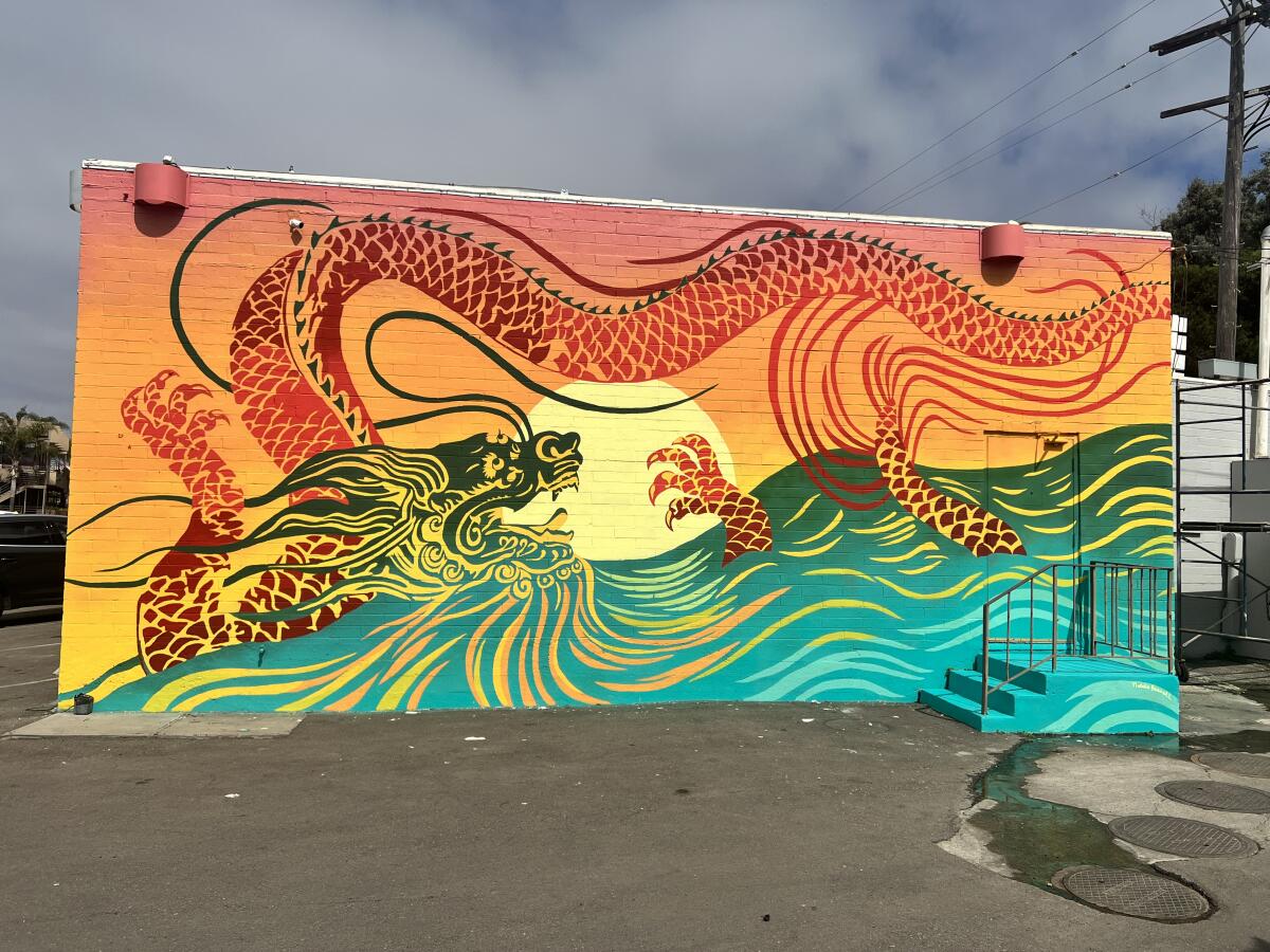 Artist Natalie Bessell says "The Dragon Mural" has elements representative of the area, which is close to Windansea Beach.