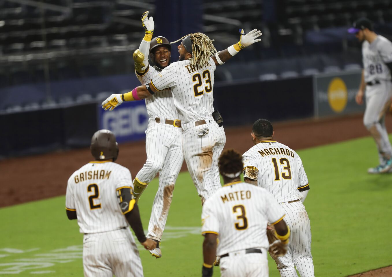 San Diego Padres Jurickson Profar celebrates his game-winning hit with Fernando Tatis Jr., right, in the bottom of the 9th inning to beat the Colorado Rockies 1-0.