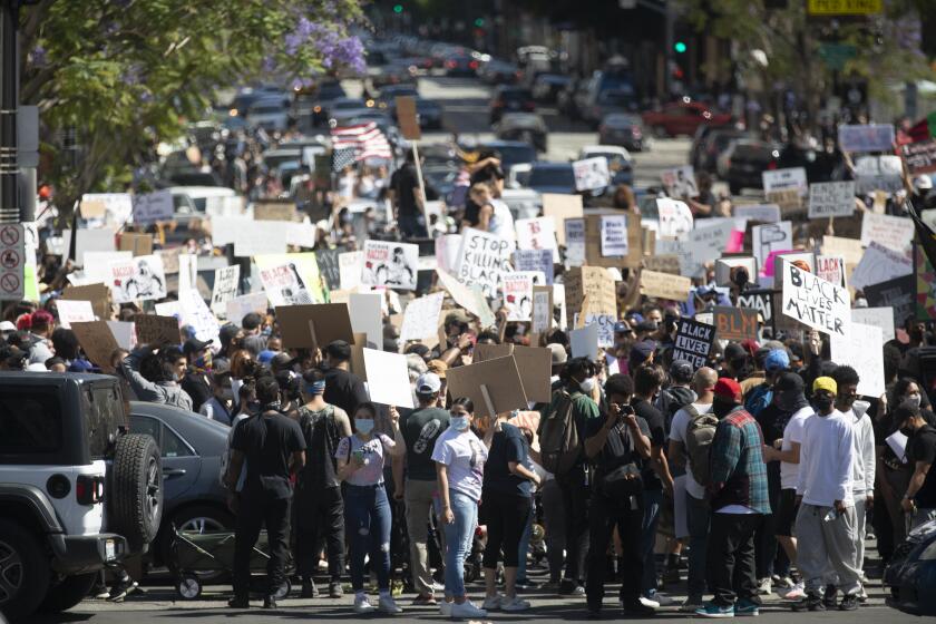 HOLLYWOOD, CA JUNE 7, 2020: Thousands of people participated in today's peaceful march peaceful march in Hollywood, CA today Sunday June 7, 2020 against police brutality sparked by the death of George Floyd. (Francine Orr/ Los Angeles Times)