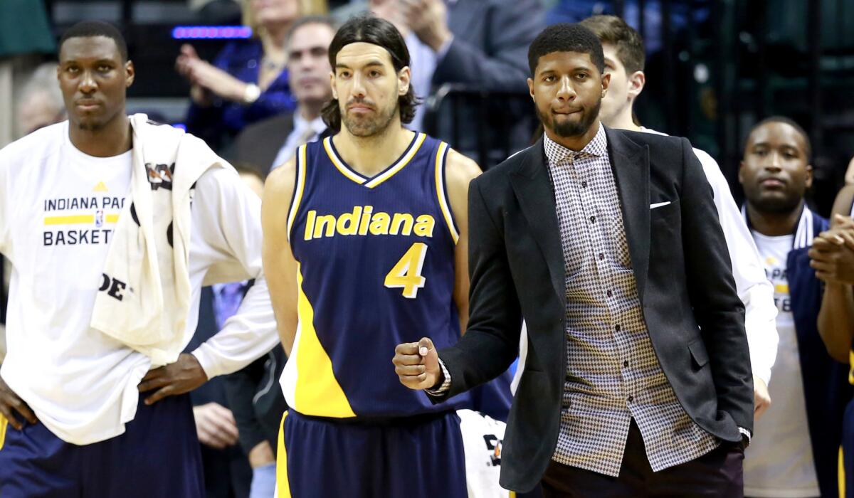 Paul George (in suit) might soon be in uniform for the Pacers, who are making a push for the playoffs.