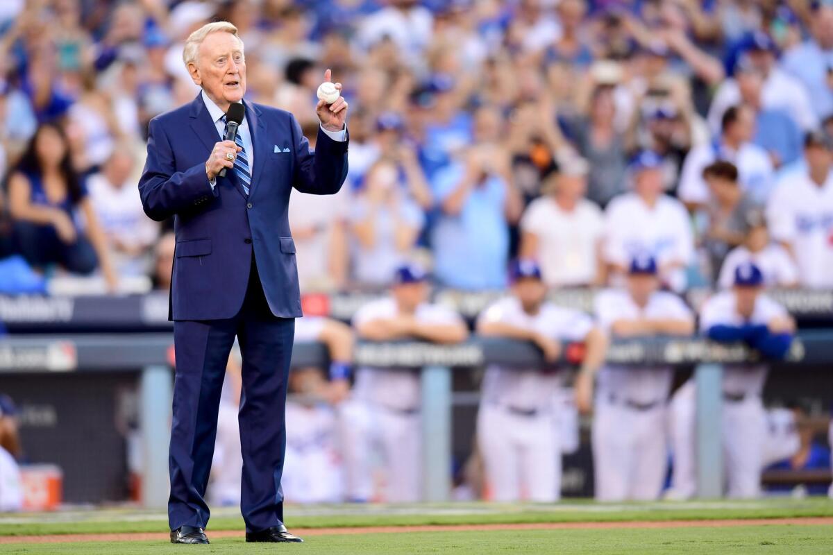 Former Dodgers broadcaster Vin Scully speaks during a pregame ceremony at Dodger Stadium.