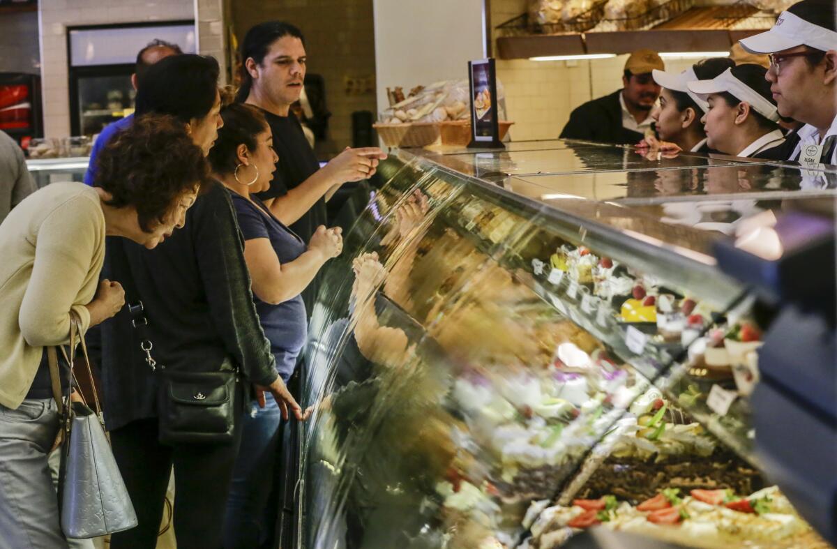 Shoppers peruse the pastry case at Porto's Bakery & Cafe in Glendale.