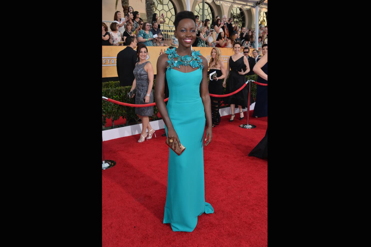 It's not exactly the jaw-dropping moment she had at the Golden Globes, but it's still pretty fabulous. What makes Nyong'o's Gucci turquoise silk column stand out is the floral detail at the neckline. Who needs jewelry?
