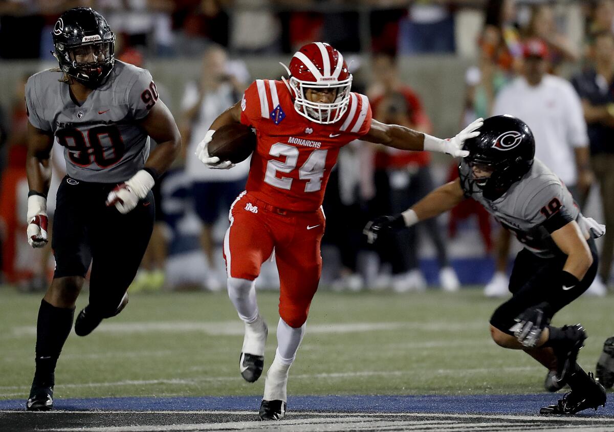 Mater Dei running back Quincy Craig breaks free on a touchdown run against Centennial on Aug. 23, 2019.